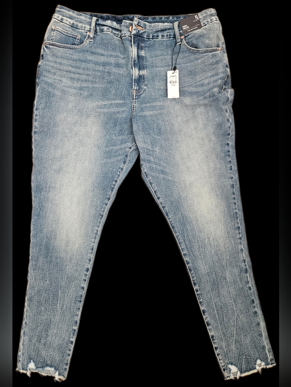 Express White Retail Tag on Blue Denim